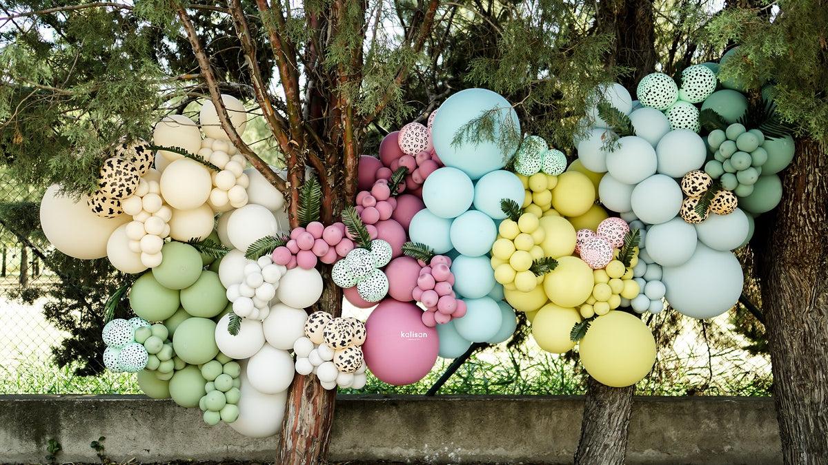 Kalisan Macaron pastel balloon garland with pink, lilac, blue and yellow latex balloons for weddings and birthday decorations